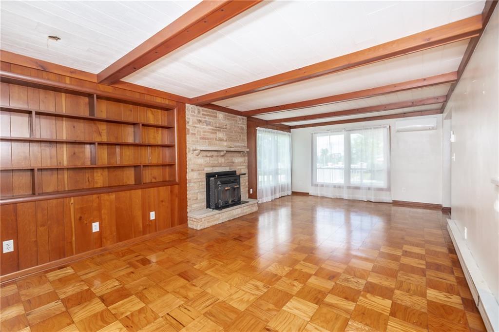 225 Courtland Road Indiana, PA 15701 - Photo 9 of 38 a view of empty room with wooden floor and fireplace