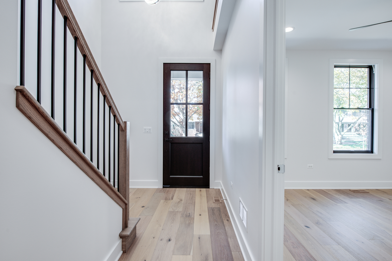 116 North Wright Street, Unit 5 Naperville, IL 60540 - Photo 29 of 62 a view of a hallway with wooden floor and stairs