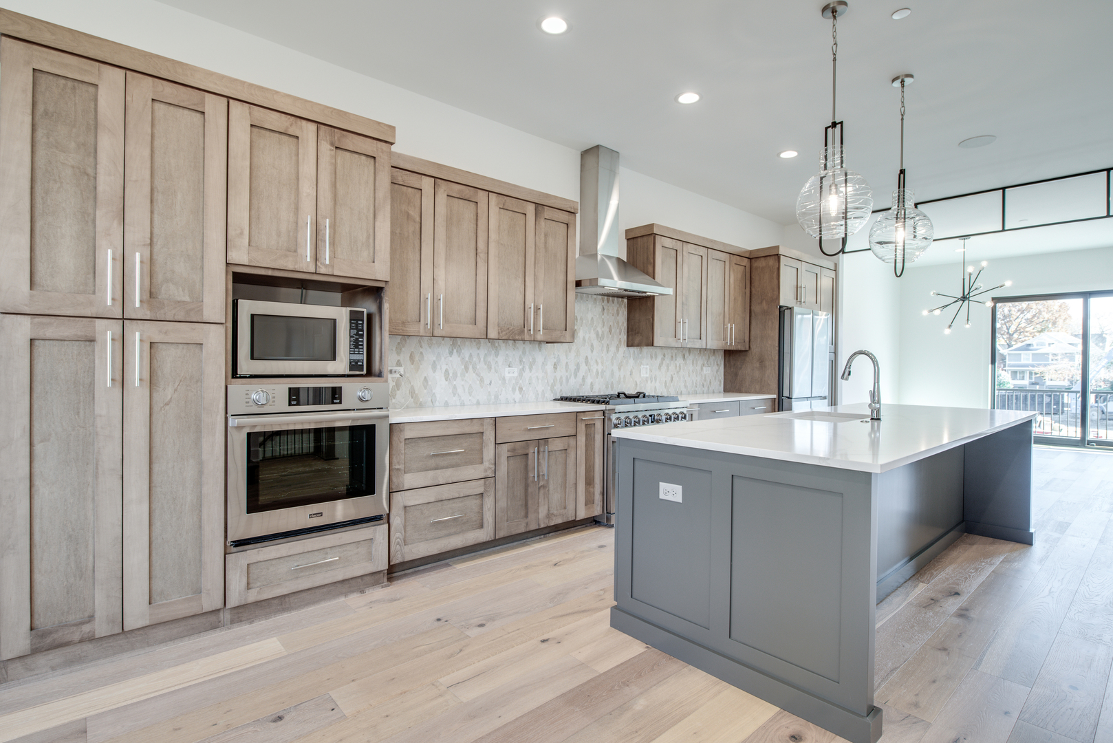 116 North Wright Street, Unit 5 Naperville, IL 60540 - Photo 32 of 62 a kitchen with kitchen island granite countertop a stove oven and a sink with cabinets