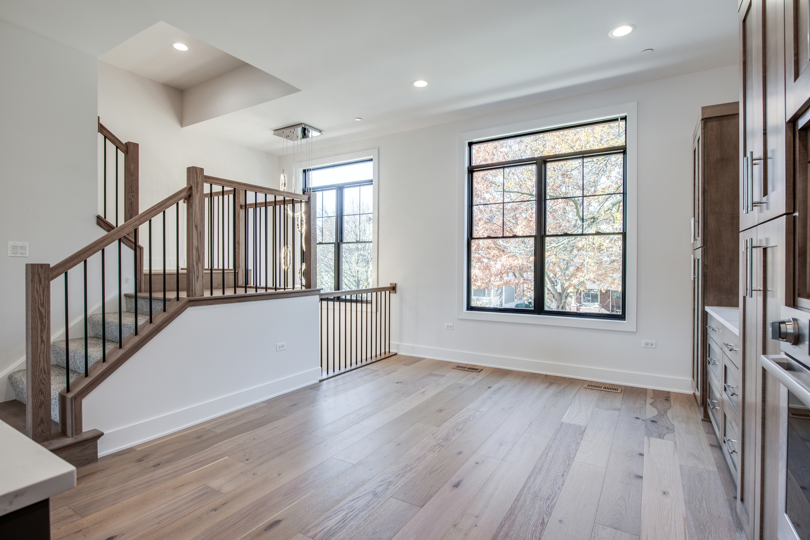 116 North Wright Street, Unit 5 Naperville, IL 60540 - Photo 38 of 62 an empty room with wooden floor and windows