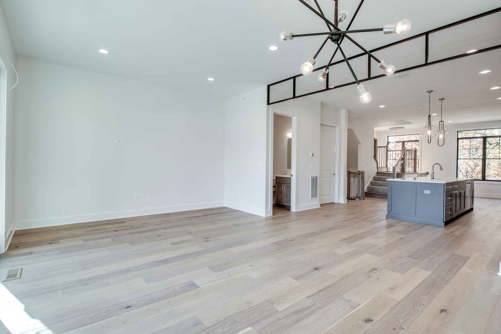 116 North Wright Street, Unit 5 Naperville, IL 60540 - Photo 40 of 62 a view of a big room with wooden floor and windows