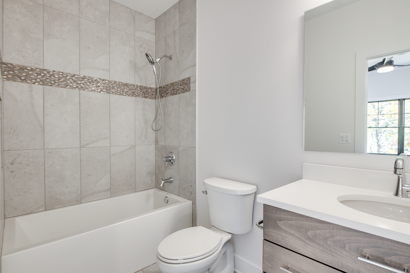 116 North Wright Street, Unit 5 Naperville, IL 60540 - Photo 46 of 62 a bathroom with a sink a toilet and a bathtub