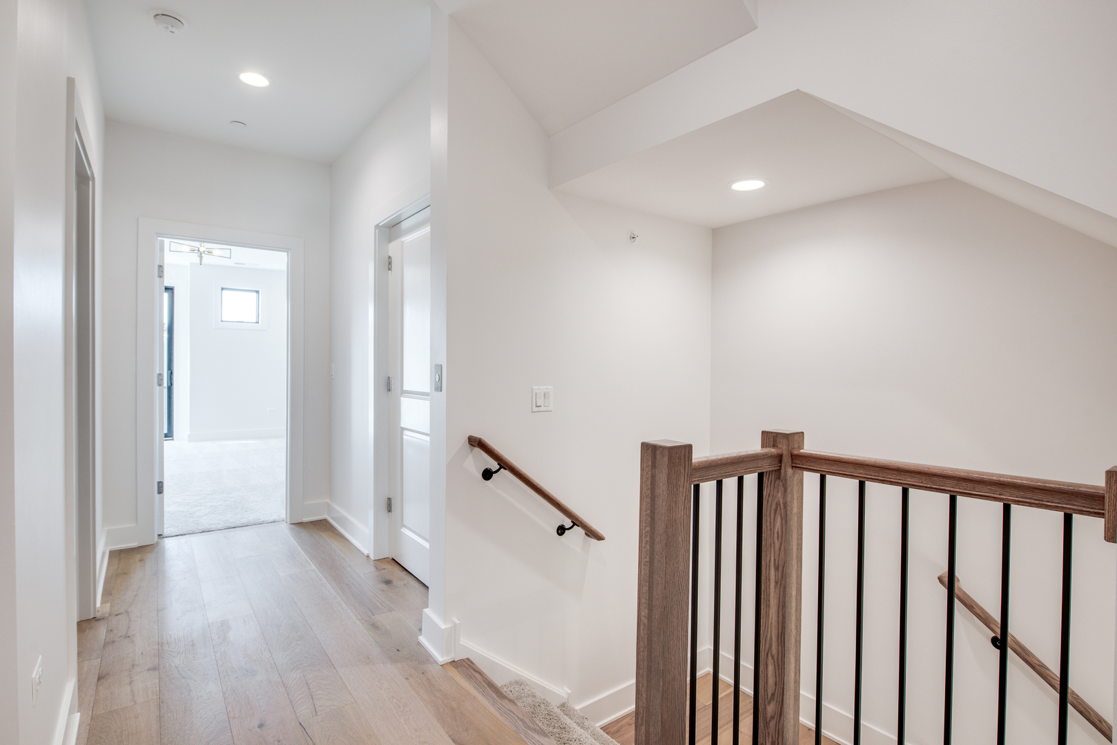 116 North Wright Street, Unit 5 Naperville, IL 60540 - Photo 48 of 62 a view of a hallway with wooden floor