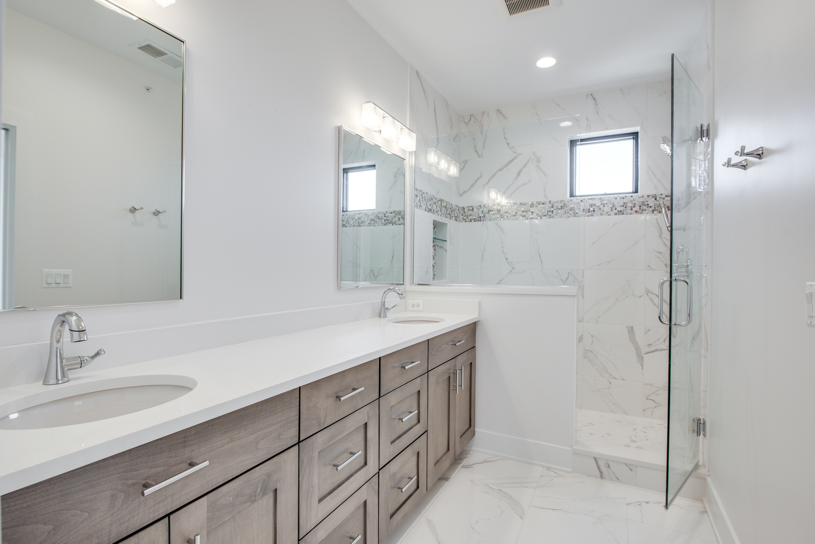 116 North Wright Street, Unit 5 Naperville, IL 60540 - Photo 52 of 62 a bathroom with a sink a shower a mirror and a bathtub