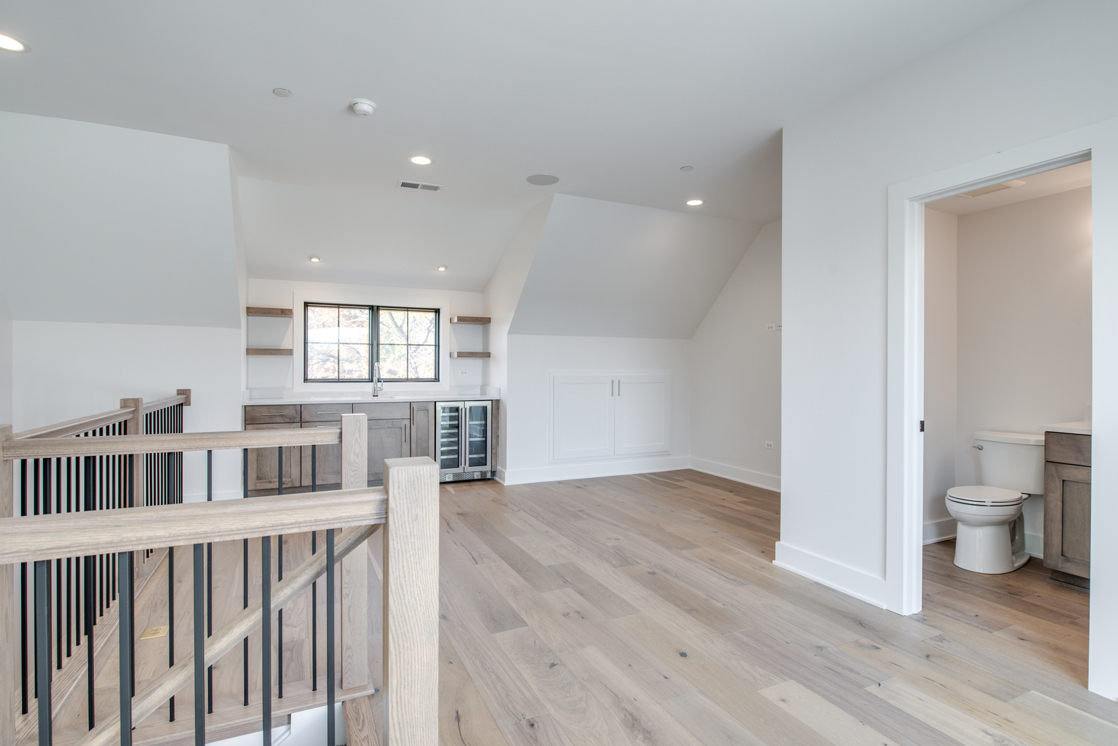 116 North Wright Street, Unit 5 Naperville, IL 60540 - Photo 53 of 62 a view of a room with wooden floor and a bathroom
