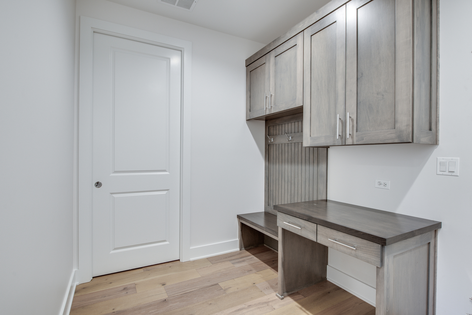 116 North Wright Street, Unit 5 Naperville, IL 60540 - Photo 57 of 62 a kitchen with granite countertop a stove and a wooden cabinets
