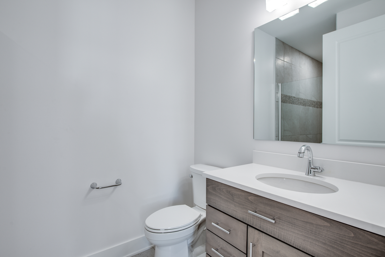 116 North Wright Street, Unit 5 Naperville, IL 60540 - Photo 58 of 62 a bathroom with a sink and a toilet