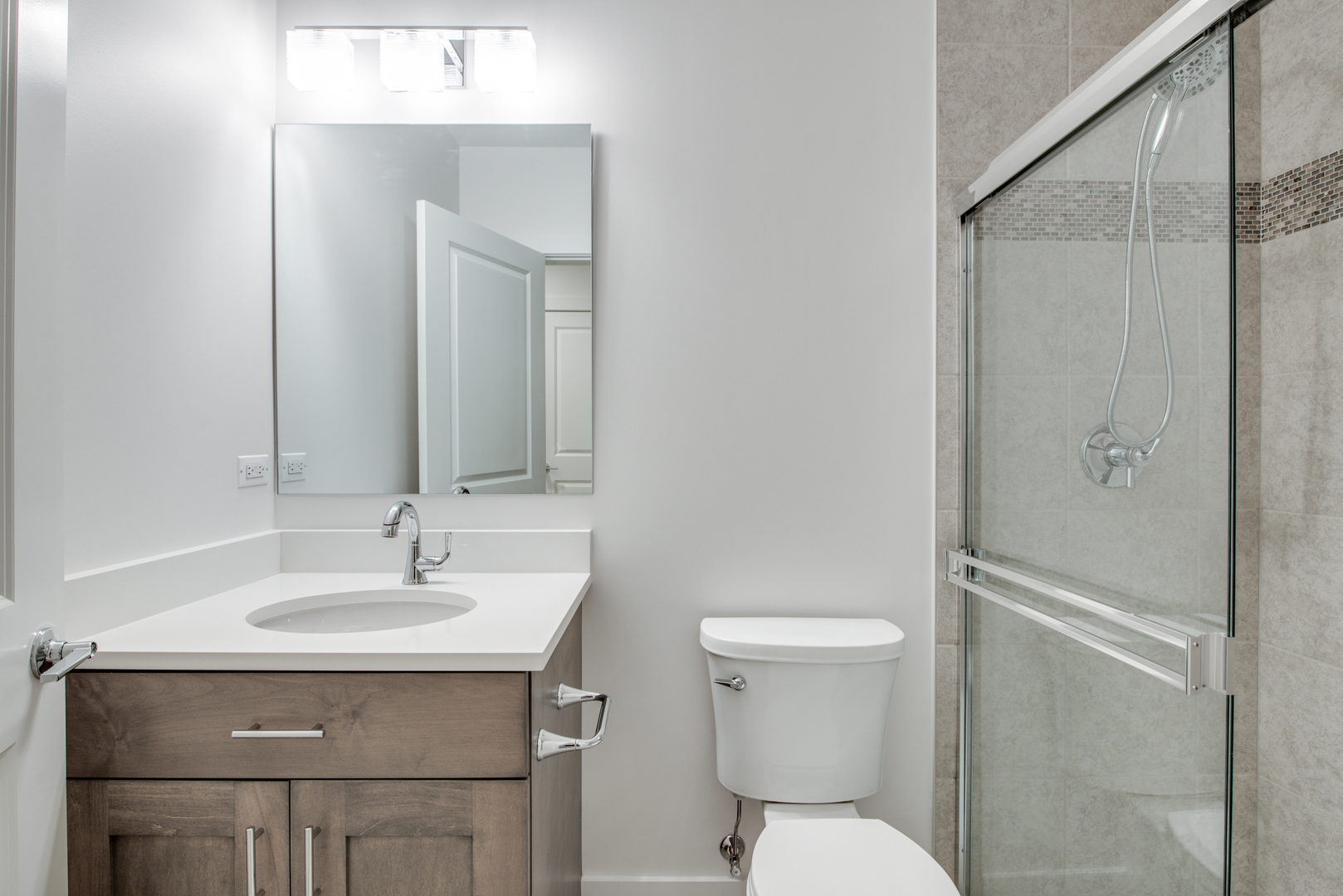 116 North Wright Street, Unit 5 Naperville, IL 60540 - Photo 62 of 62 a bathroom with a sink toilet and mirror