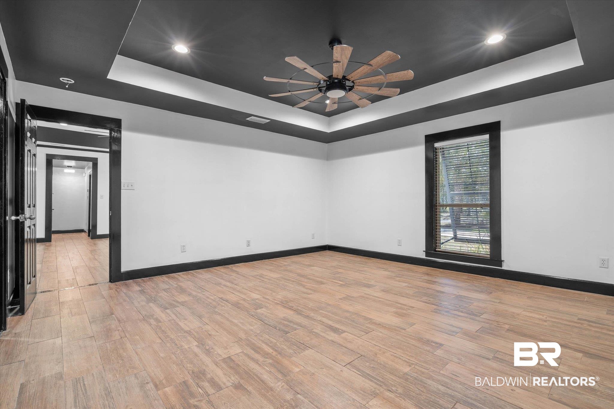 3216 Bay Booster Club Road Theodore, AL 36582 - Photo 11 of 46 Spare room featuring a raised ceiling, a ceiling fan, recessed lighting, and light wood finished floors