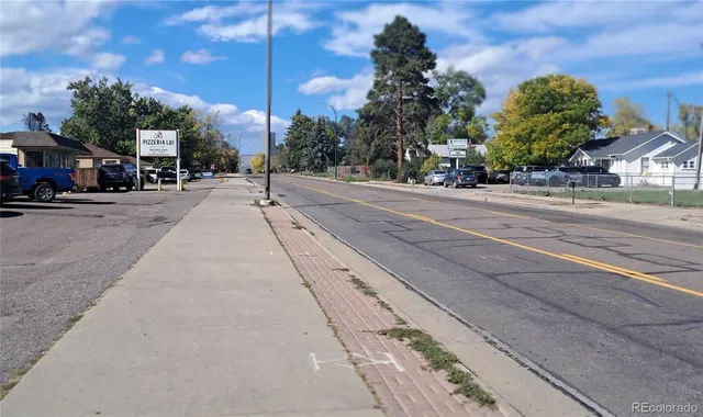 a view of the street with cars