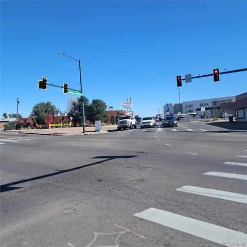 a view of a street with a sign board