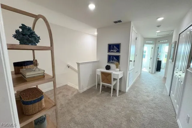 a bathroom with double vanity and a mirror
