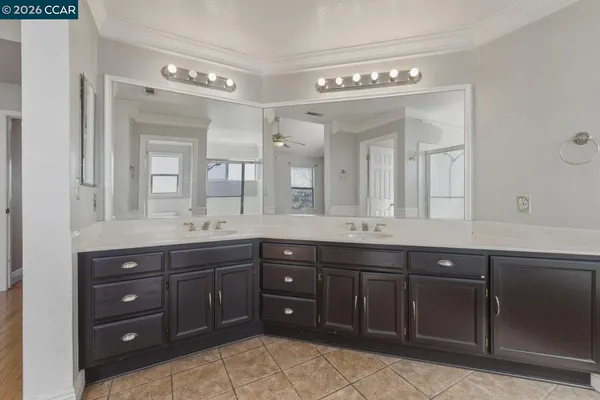 a bathroom with a glass shower door