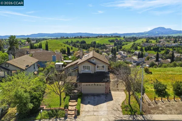 an aerial view of a house with a garden