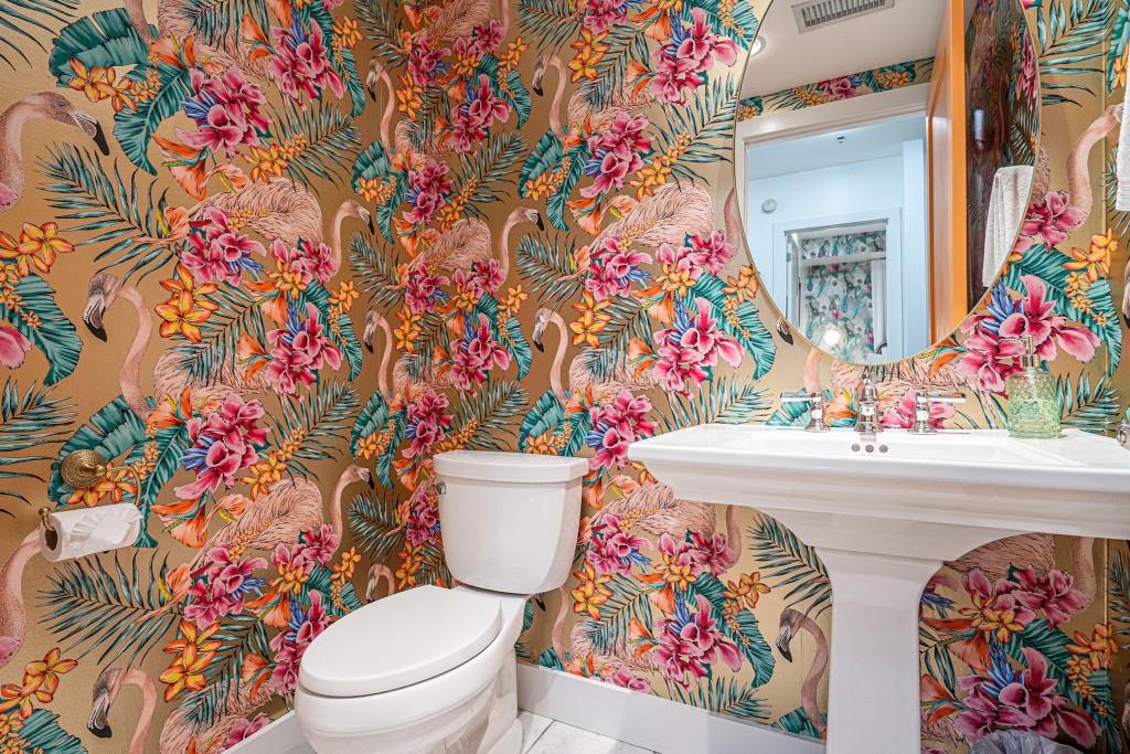 1100 Howell Mill Road Northwest, Unit 808 Atlanta, GA 30318 - Photo 11 of 48 a bathroom with a toilet sink and mirror