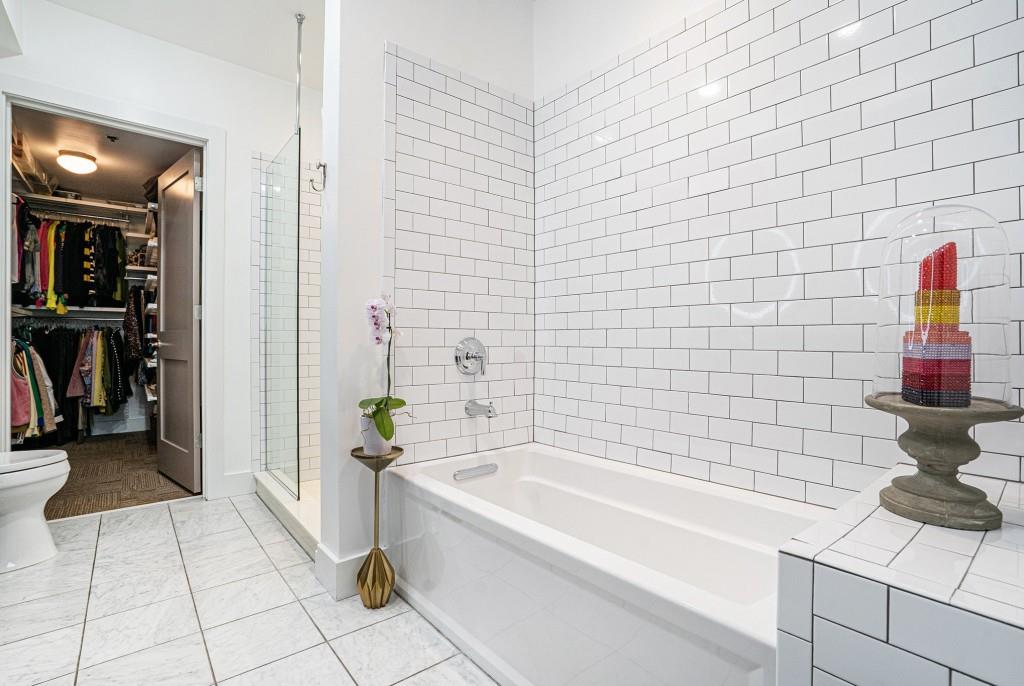 1100 Howell Mill Road Northwest, Unit 808 Atlanta, GA 30318 - Photo 26 of 48 a bathroom with a bathtub and a shower