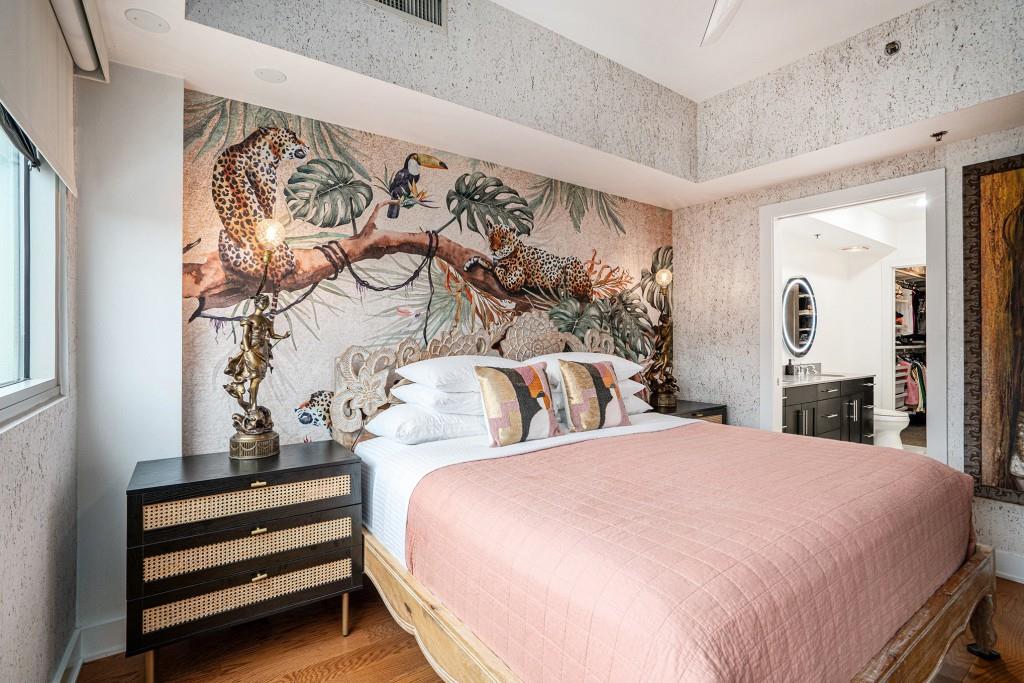 1100 Howell Mill Road Northwest, Unit 808 Atlanta, GA 30318 - Photo 3 of 48 a bedroom with a bed and a mirror