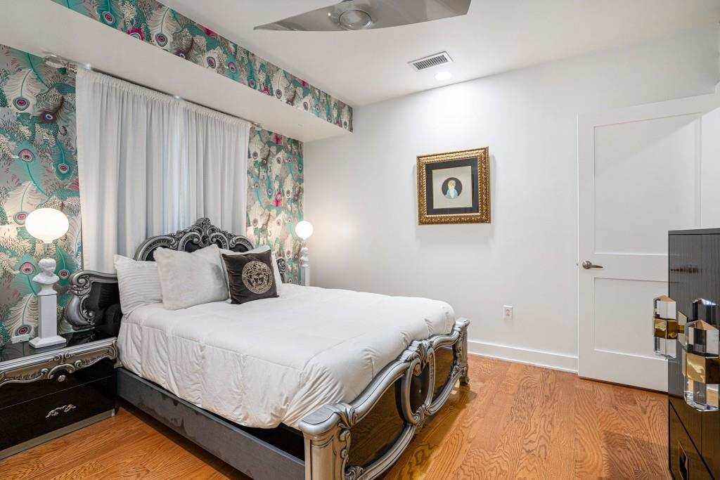 1100 Howell Mill Road Northwest, Unit 808 Atlanta, GA 30318 - Photo 36 of 48 a bed room with a bed and a tv