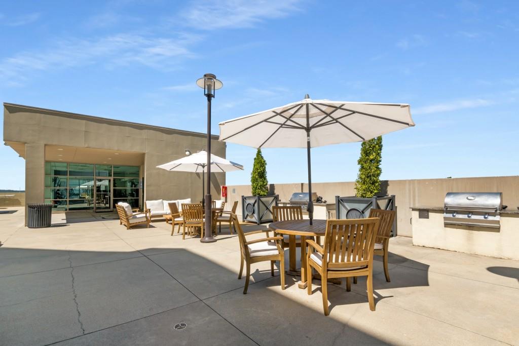 1100 Howell Mill Road Northwest, Unit 808 Atlanta, GA 30318 - Photo 38 of 48 a view of outdoor space with seating area and barbeque oven