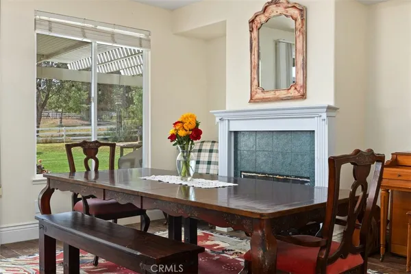 a dining room with furniture and window