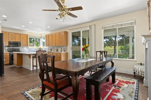a view of a dining room with furniture and window