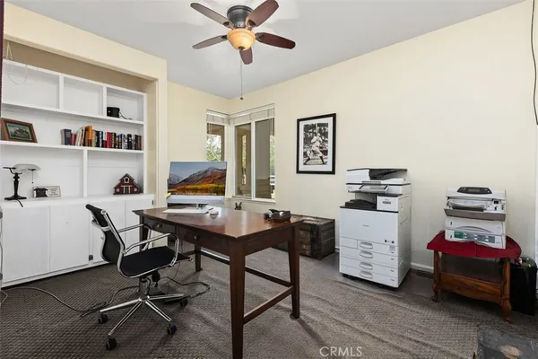 a view of a workspace with furniture