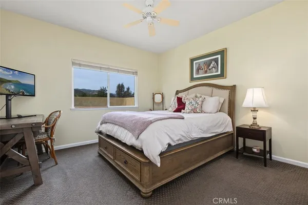 a bedroom with a bed and a table in it