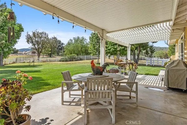 a view of a patio with a yard