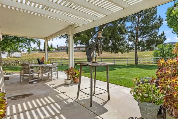 a view of a swimming pool with a patio