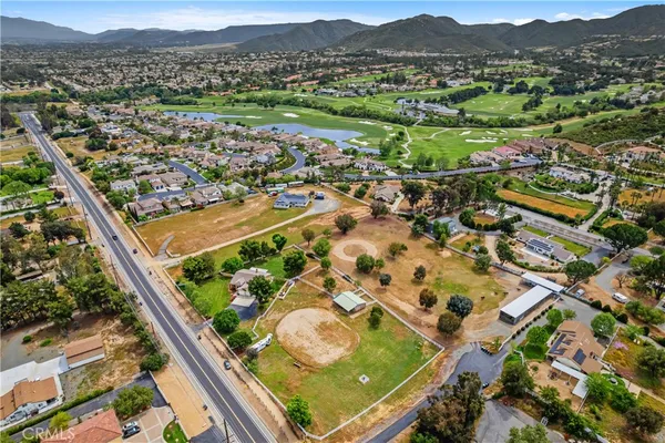 an aerial view of residential houses and outdoor space