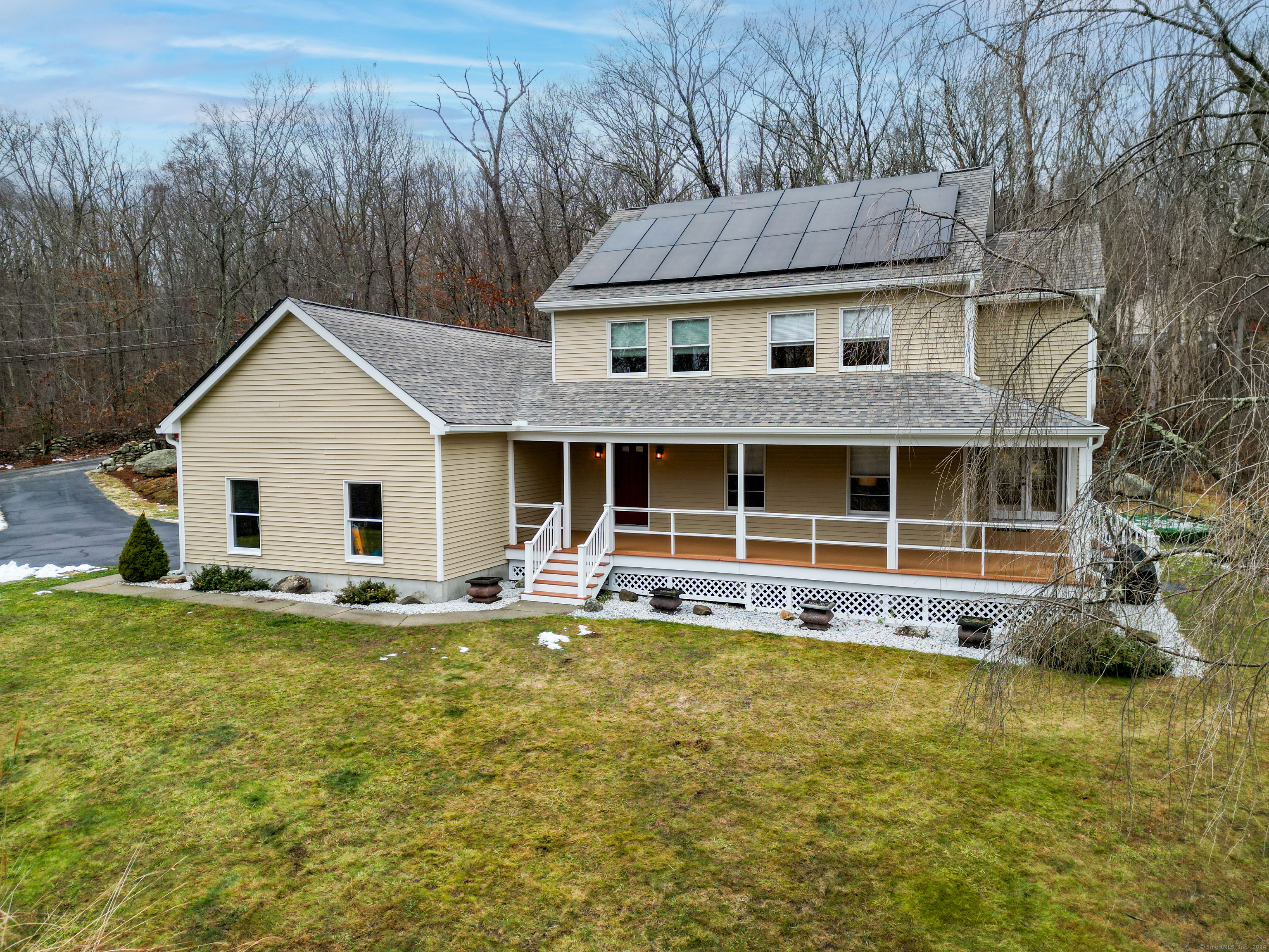 63 Papermill Road Hebron, CT 06231 - Photo 1 of 1 a view of a house with a yard and sitting area