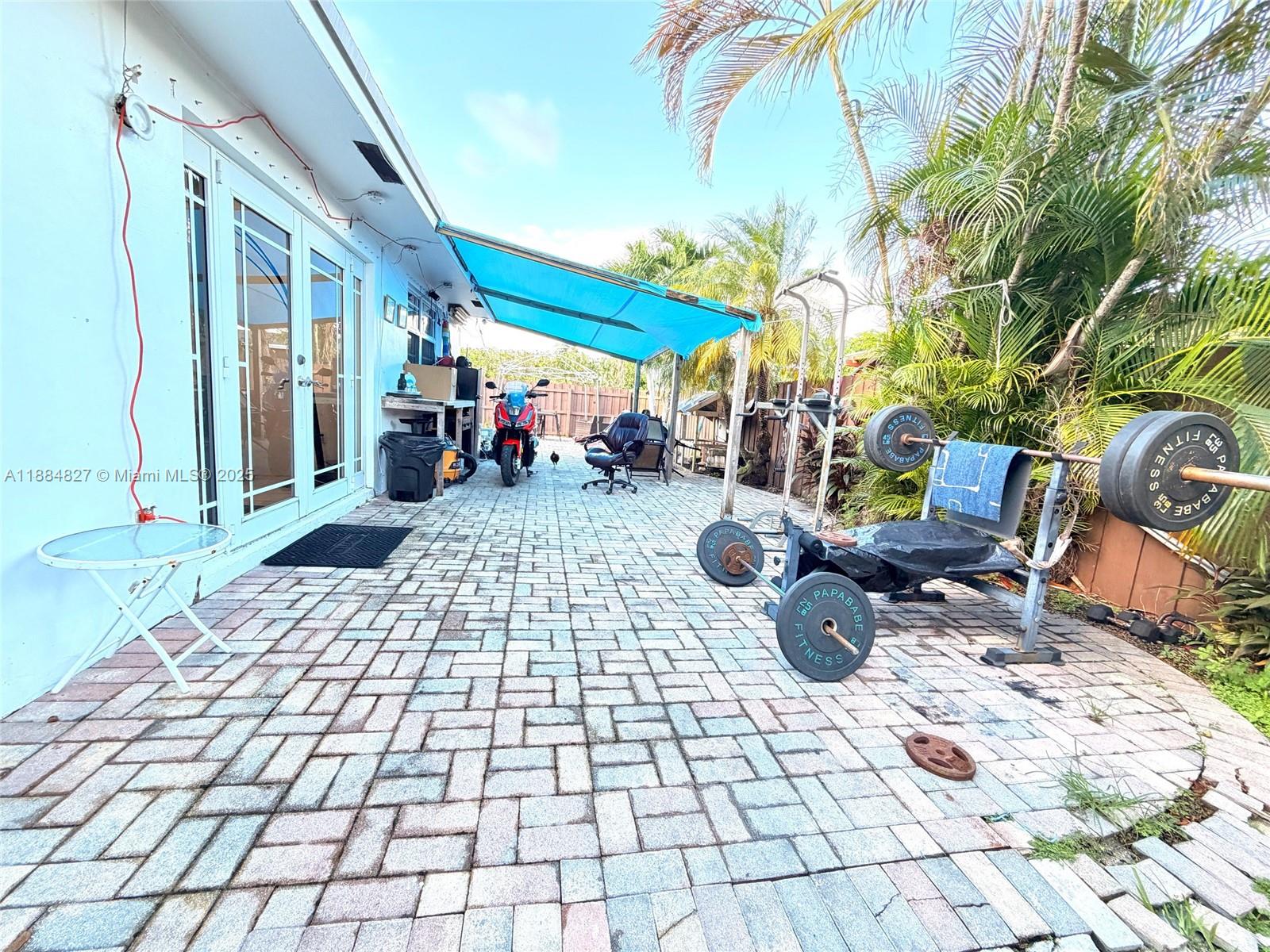 401 Southeast 5th Street Dania Beach, FL 33004 - Photo 9 of 9 a view of a patio with table and chairs
