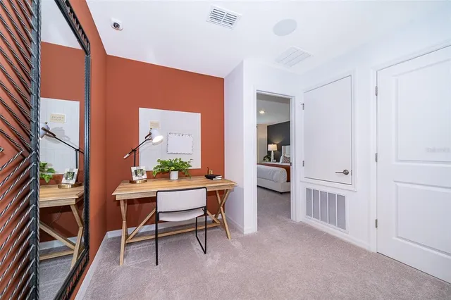 a workspace with furniture and window