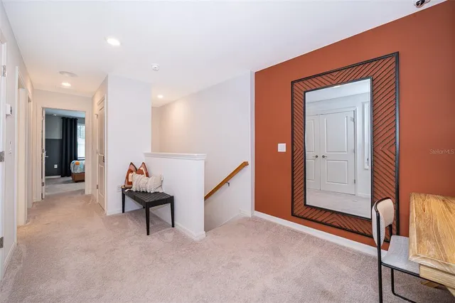 a view of an empty room and wooden floor