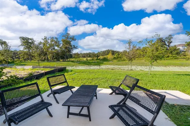 a view of a swimming pool with a lounge chair