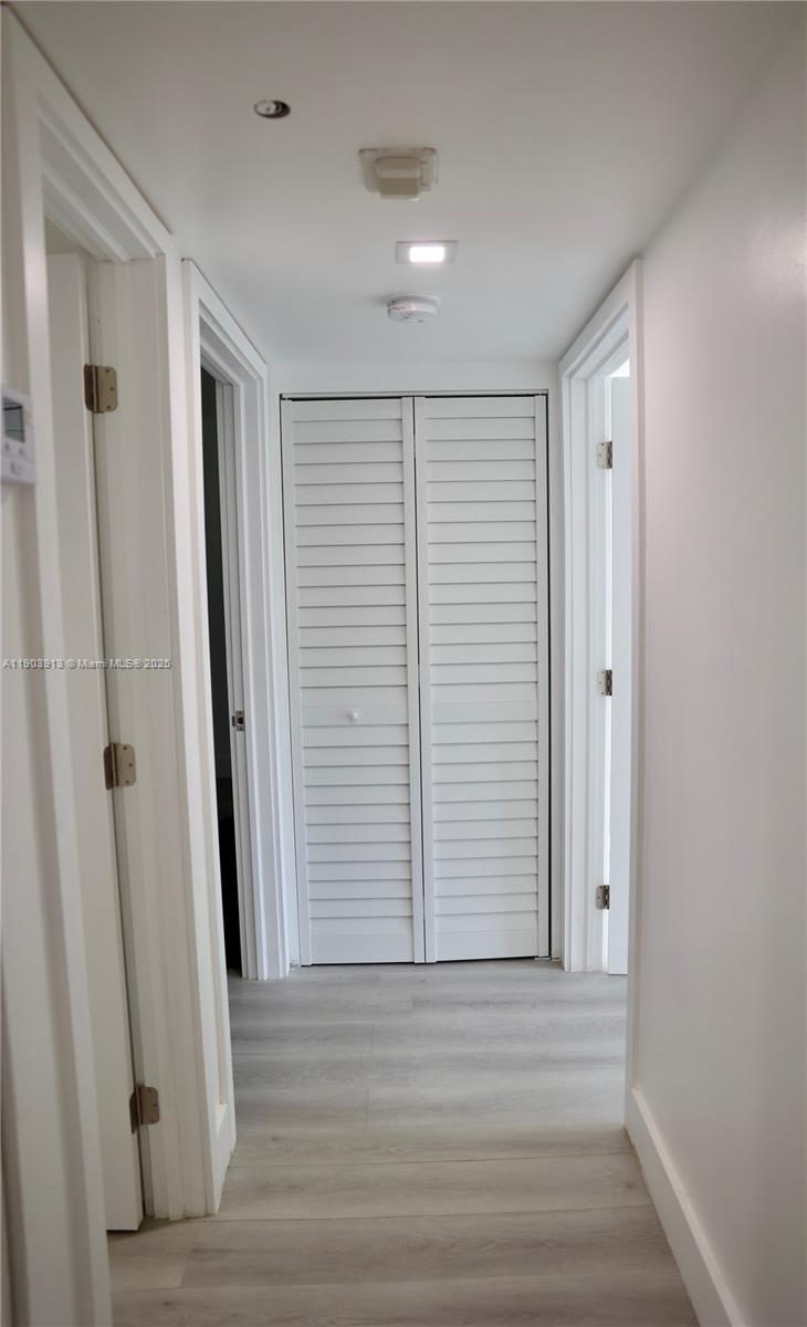 8730 Southwest 133rd Avenue Road, Unit 216 Miami, FL 33183 - Photo 14 of 28 a view of a hallway with wooden floor and entryway