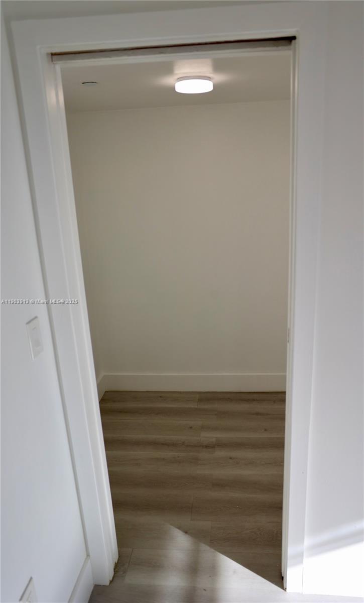 8730 Southwest 133rd Avenue Road, Unit 216 Miami, FL 33183 - Photo 19 of 28 a view of closet with wooden floor