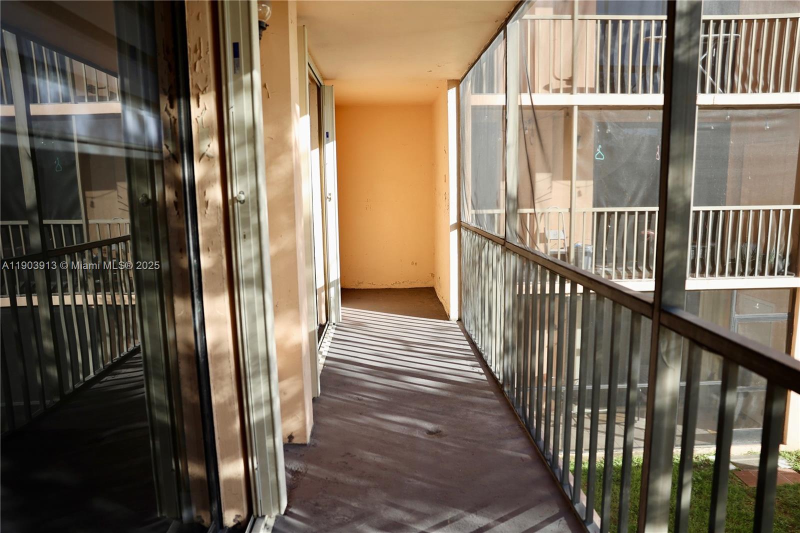 8730 Southwest 133rd Avenue Road, Unit 216 Miami, FL 33183 - Photo 23 of 28 a view of a balcony with wooden floor