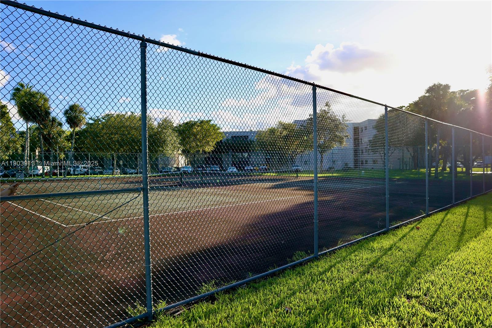 8730 Southwest 133rd Avenue Road, Unit 216 Miami, FL 33183 - Photo 26 of 28 a view of a tennis court