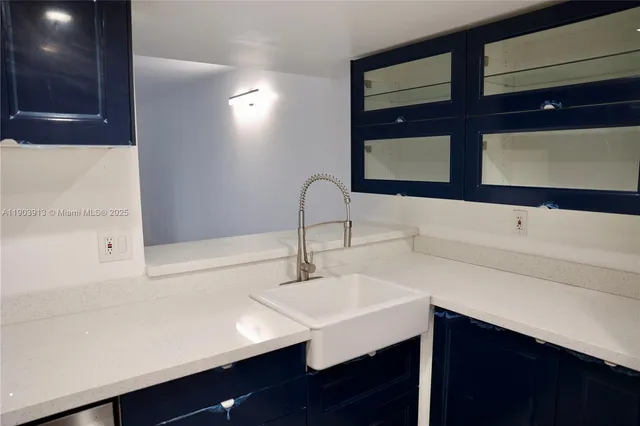 a white refrigerator freezer sitting in a kitchen