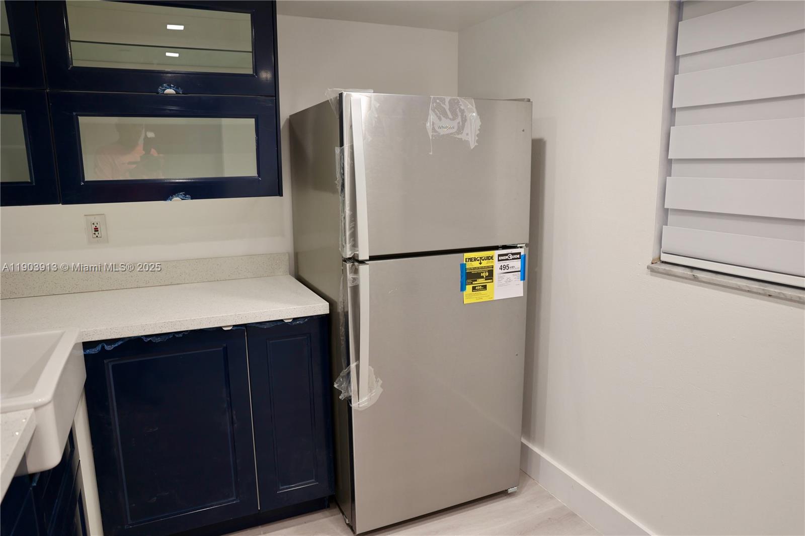 8730 Southwest 133rd Avenue Road, Unit 216 Miami, FL 33183 - Photo 8 of 28 a white refrigerator freezer sitting in a kitchen
