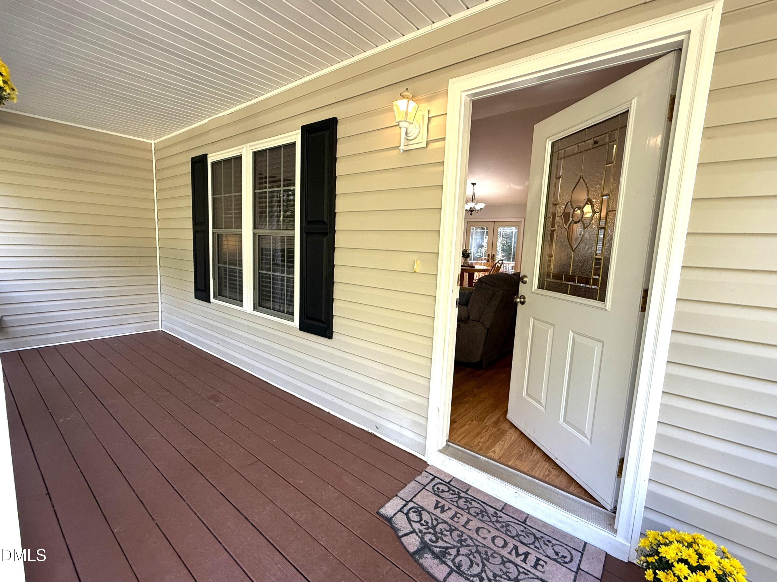 127 Cobble Brook Drive Rougemont, NC 27572 - Photo 28 of 48 a view of a porch with wooden floor and stairs