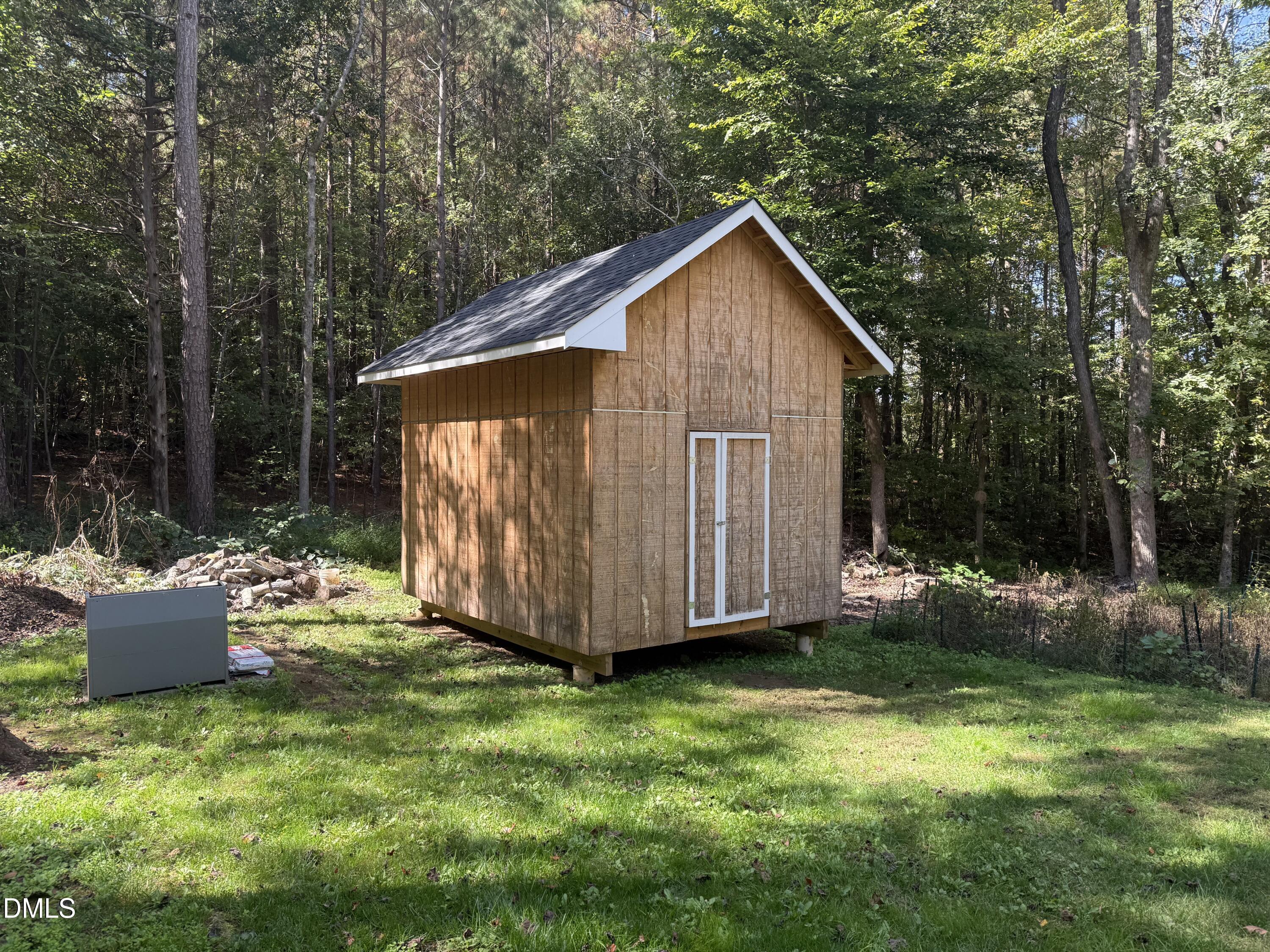 127 Cobble Brook Drive Rougemont, NC 27572 - Photo 33 of 48 a view of backyard with tub and trees
