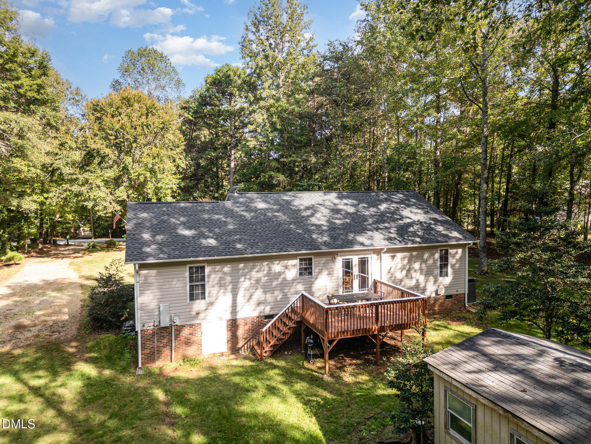 127 Cobble Brook Drive Rougemont, NC 27572 - Photo 35 of 48 a aerial view of a house with a yard table and chairs