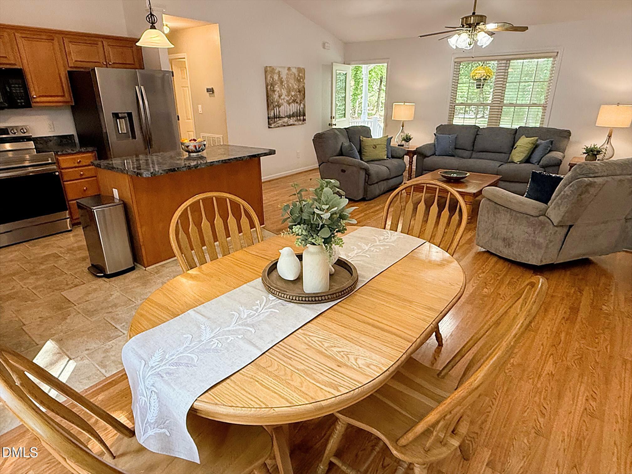 127 Cobble Brook Drive Rougemont, NC 27572 - Photo 4 of 48 a living room with furniture a fireplace and a table