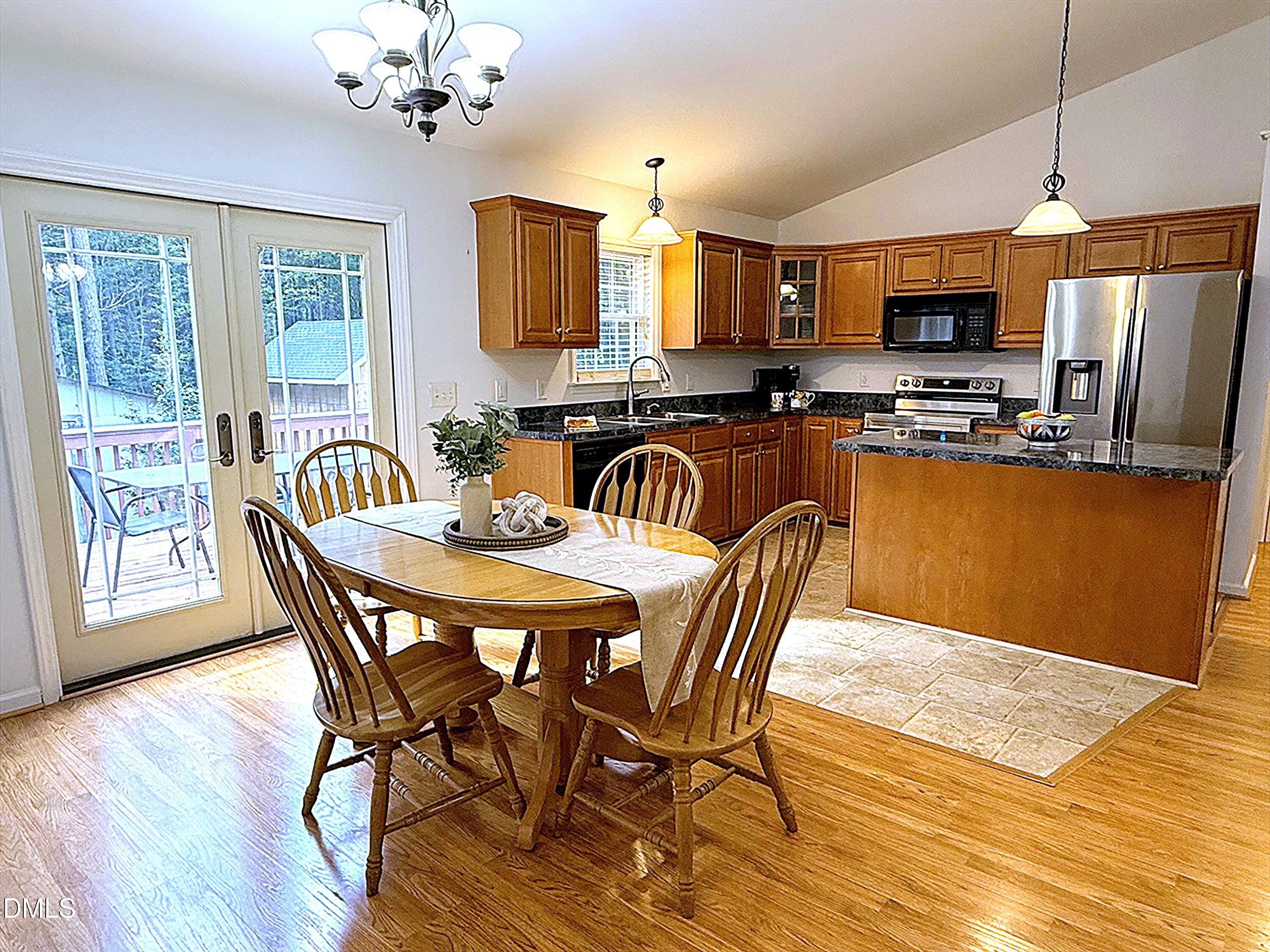 127 Cobble Brook Drive Rougemont, NC 27572 - Photo 5 of 48 a dining room with furniture a window and wooden floor