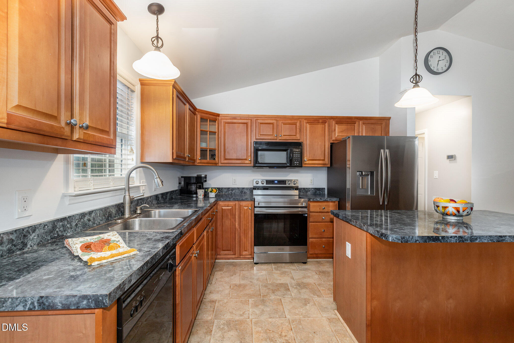 127 Cobble Brook Drive Rougemont, NC 27572 - Photo 7 of 48 a kitchen with stainless steel appliances granite countertop a sink a stove and a refrigerator