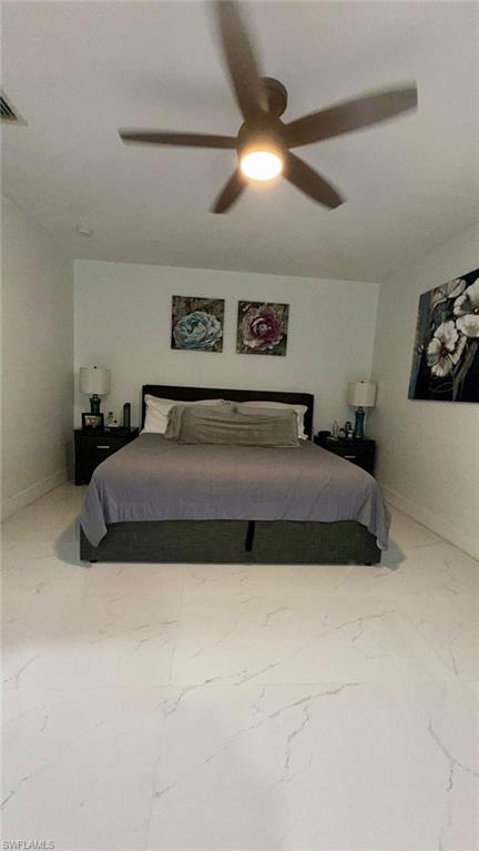 14122 Southwest 276th Street Homestead, FL 33032 - Photo 11 of 47 Bedroom with ceiling fan and light marble finish floors