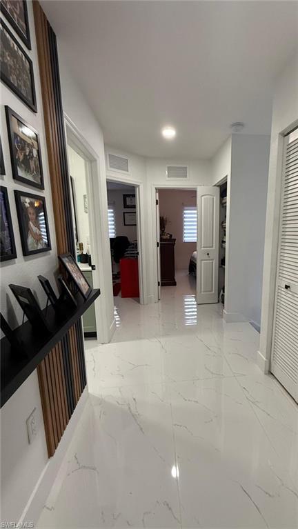 14122 Southwest 276th Street Homestead, FL 33032 - Photo 25 of 47 Hallway with light marble finish floors and baseboards