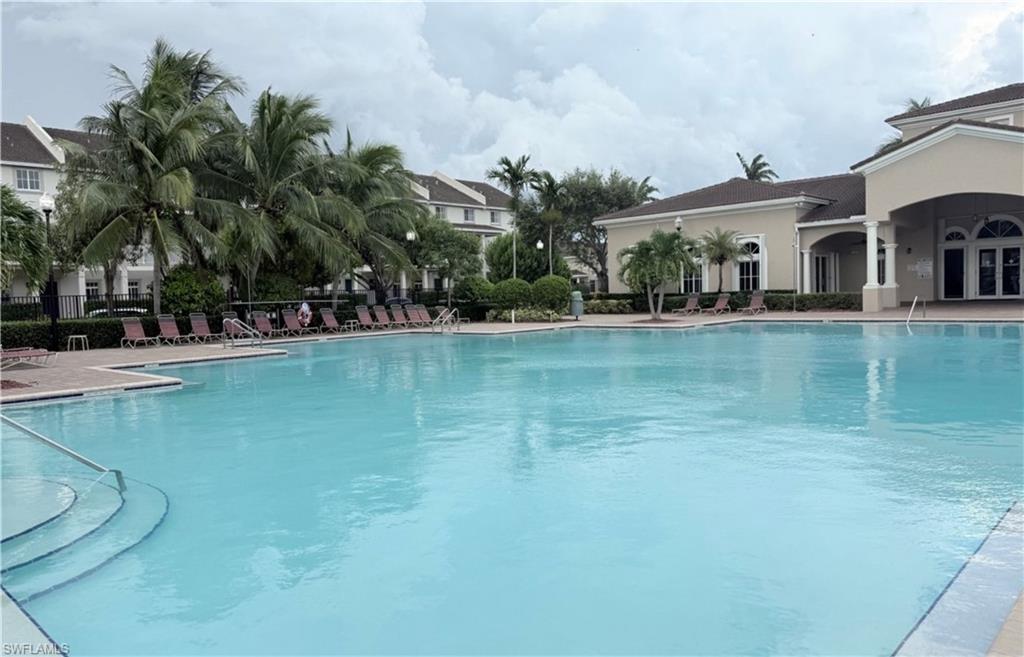 14122 Southwest 276th Street Homestead, FL 33032 - Photo 36 of 47 Community pool with a patio